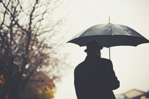 Senior man holding an umbrella